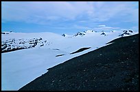 Rocky slope and snow-covered Harding Icefield at dusk. Kenai Fjords National Park ( color)