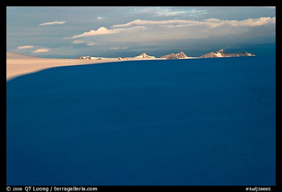 Distant mountains emerging from shadows over the Harding field. Kenai Fjords National Park (color)