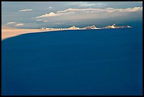 Distant mountains emerging from shadows over the Harding field. Kenai Fjords National Park, Alaska, USA.