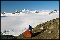 Tent and backpacker above the Harding icefield. Kenai Fjords National Park, Alaska, USA.