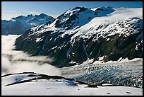 Peaks, glacier, and sea of clouds, morning. Kenai Fjords National Park, Alaska, USA.