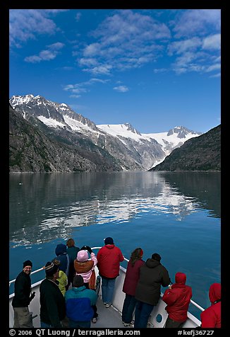 Mountains reflected in fjord, seen by tour boat passengers, Northwestern Fjord. Kenai Fjords National Park, Alaska, USA.