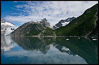 North side of fjord and reflections, Northwestern Fjord. Kenai Fjords National Park, Alaska, USA.