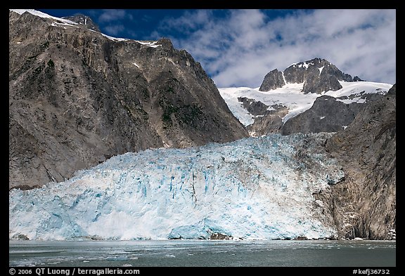 Northwestern tidewater glacier and steep cliffs, Northwestern Fjord. Kenai Fjords National Park, Alaska, USA.