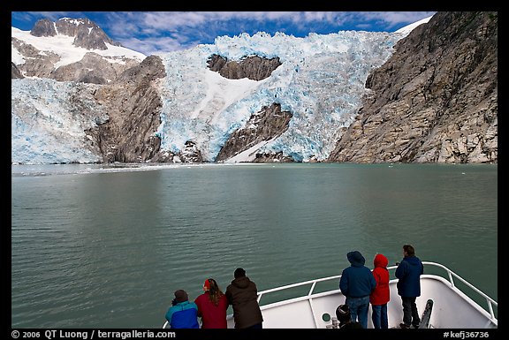 People looking at Northwestern glacier from deck of boat, Northwestern Fjord. Kenai Fjords National Park, Alaska, USA.