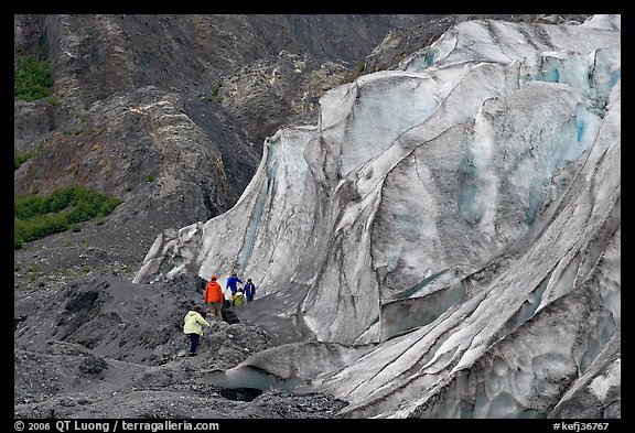 Family exploring at the base of Exit Glacier. Kenai Fjords National Park, Alaska, USA.