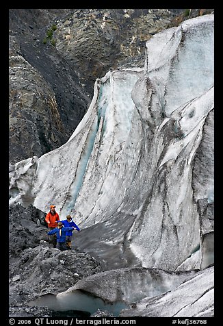 Man and children hiking on moraine at the base of Exit Glacier. Kenai Fjords National Park, Alaska, USA.