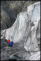 Man and children hiking on moraine at the base of Exit Glacier. Kenai Fjords National Park, Alaska, USA. (color)