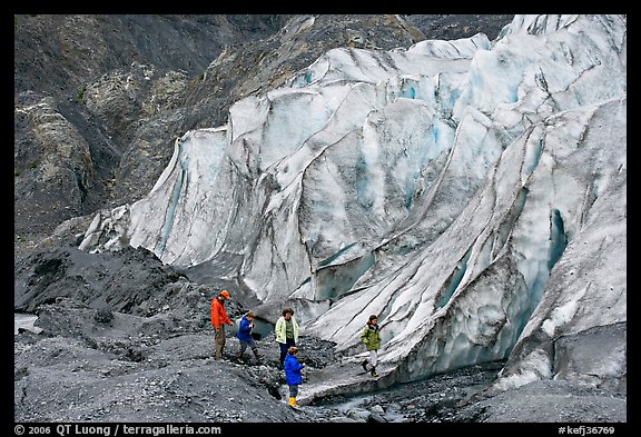 Family hiking on moraine at the base of Exit Glacier. Kenai Fjords National Park (color)