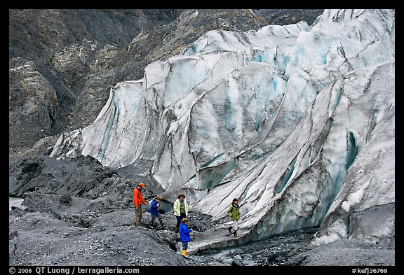 Family hiking on moraine at the base of Exit Glacier. Kenai Fjords National Park, Alaska, USA.