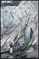 Couple checking out the ice at the terminus of Exit Glacier. Kenai Fjords National Park, Alaska, USA. (color)