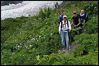 Women carrying infants on trail. Kenai Fjords National Park, Alaska, USA. (color)