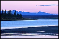 Sand bar shore, river and Baird mountains, evening. Kobuk Valley National Park, Alaska, USA.