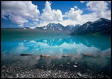 Clouds and Telaquana Mountains above Turquoise Lake, from the middle of the lake. Lake Clark National Park, Alaska, USA.