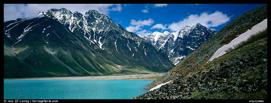 Rugged mountains rising above lake with turquoise waters. Lake Clark National Park (color)