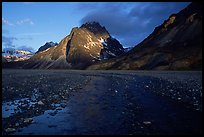 Gravel river bar below the Telaquana Mountains, sunset.. Lake Clark National Park, Alaska, USA.