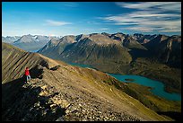 Visitor looking, summit of Tanalian Mountain and Kontrashibuna Lake. Lake Clark National Park ( color)