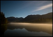 Kontrashibuna Lake with thin layer of mist at night. Lake Clark National Park, Alaska, USA.