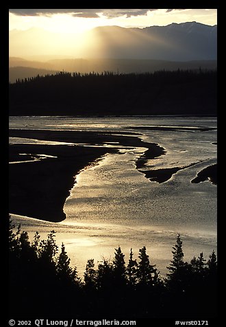 Early morning sun shining on the wide Chitina river. Wrangell-St Elias National Park, Alaska, USA.