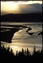 Early morning sun shining on the wide Chitina river. Wrangell-St Elias National Park, Alaska, USA.