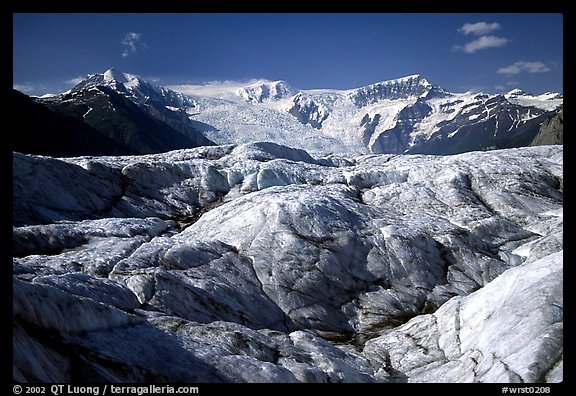 Crevasses on Root glacier, Wrangell mountains in the background. Wrangell-St Elias National Park, Alaska, USA.