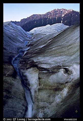 Root Glacier with glacial stream, and mountains. Wrangell-St Elias National Park, Alaska, USA.