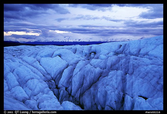 Crevasses on Root glacier at dusk, Chugach mountains in the background. Wrangell-St Elias National Park, Alaska, USA.