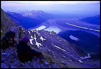 Mountaineer looking down from Donoho Peak. Wrangell-St Elias National Park, Alaska, USA.