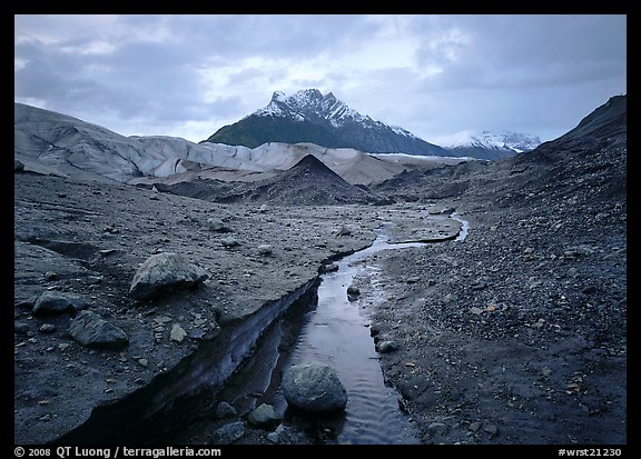 Mt Donoho above moraine, stream, and Root glacier. Wrangell-St Elias National Park, Alaska, USA.