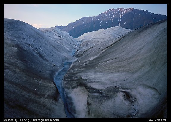 Root Glacier, glacial stream, and mountains at dusk. Wrangell-St Elias National Park (color)