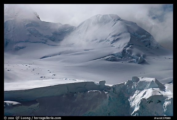 Aerial view of seracs and snowy peak, University Range. Wrangell-St Elias National Park, Alaska, USA.