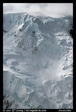 Aerial view of icy face with hanging glaciers and seracs. Wrangell-St Elias National Park, Alaska, USA.