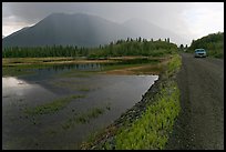 McCarthy Road and lake during afternoon storm. Wrangell-St Elias National Park, Alaska, USA.
