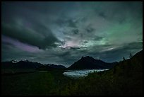 Root Glacier and Donoho Peak at night with stars, clouds, and northern lights. Wrangell-St Elias National Park ( color)