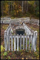 Headstone in grave fenced with white pickets, Kennecott cemetery. Wrangell-St Elias National Park ( color)