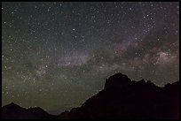 Starry sky and Milky Way above Chisos Mountains. Big Bend National Park, Texas, USA.