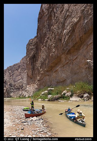 Canoeists bellow steep walls of Boquillas Canyon. Big Bend National Park (color)