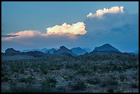 Dark desert landscape with last light falling on clouds. Big Bend National Park ( color)