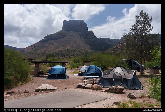 Cluster of tents fills Chisos Basin Campground under Casa Grande. Big Bend National Park (color)