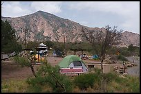 Scattered tents, vans, and picnic shelters dot Chisos Basin Campground. Big Bend National Park ( color)