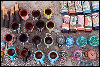 Hand-painted mugs, whistles, and small animals form a tight grid of color, each piece stamped with the name of Boquillas. Big Bend National Park ( color)