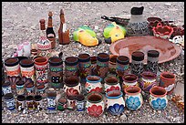 Rows of tall cups, squat vases, and bottle-shaped flasks crowd together on the stony ground. Big Bend National Park ( color)