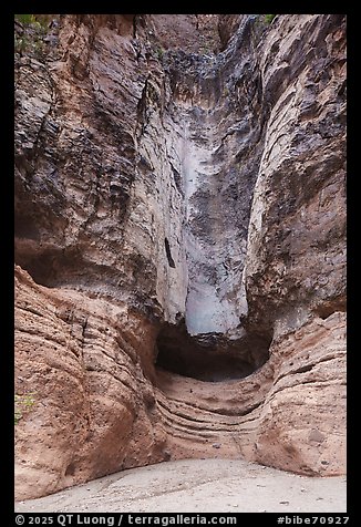 Sheer canyon walls streaked with mineral stains frame a dry Burro Mesa pour-off. Big Bend National Park (color)