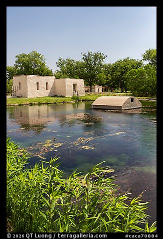 Low adobe service buildings beside the clear Rattlesnake Springs. Carlsbad Caverns National Park (color)