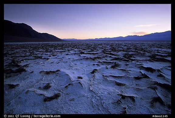 Evaporation patterns on salt flats near Badwater, dusk. Death Valley National Park, California, USA.
