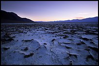 Evaporation patterns on salt flats near Badwater, dusk. Death Valley National Park, California, USA.