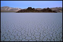 Tiles in cracked mud and Grand Stand, Racetrack playa, dusk. Death Valley National Park ( color)