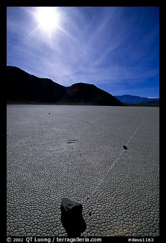 Tracks and moving rock on the Racetrack, mid-day. Death Valley National Park (color)