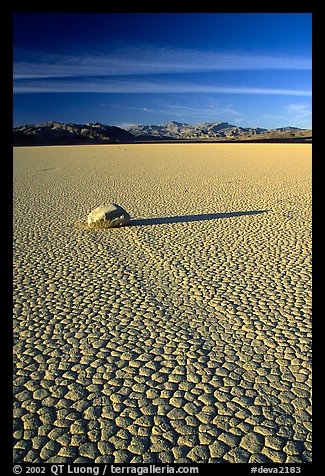 Tracks, sliding stone on the Racetrack playa, late afternoon. Death Valley National Park, California, USA.