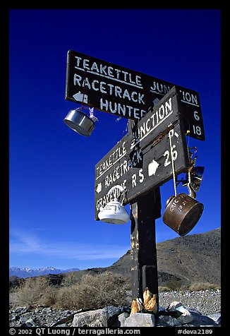 Tea kettle Junction sign, adorned with tea kettles. Death Valley National Park, California, USA.